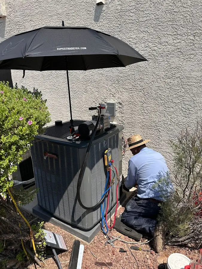 HVAC technician performing outdoor AC maintenance in Middlesborough